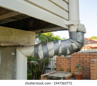 Old And Damaged Pipeline Or Downpipe Of Rain Water Had Been Fixed With Sponge And Duct Tape. The Bad Sample Of Fixing The Pipe With Poor Knowledge And Skill.