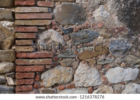 Old damaged stone wall surface texture 