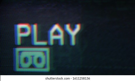 An old damaged VHS tape playing, over noise from an analog TV, with a PLAY text. Cool retro vintage background for modern videos. playing old vhs on vcr 