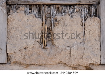 old damaged wattle and daub covered window, full-frame background and texture.