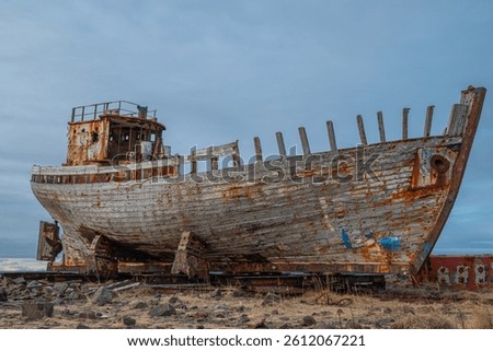 old damaged wooden boat on land in town of Akranes in west Iceland