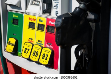 Old dangerous combustible petrol chemical gas. At the Gas station. Filling up gasoline at the gas pump. 87 octane , 89 octane , or 93 octane. With gas pump handle ready to fill up the tank - Shutterstock ID 1030596601