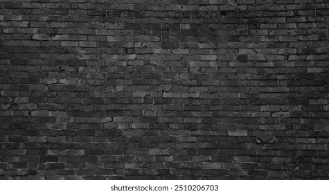 old dark black brick wall of an old architecture building. brick wall texture. dark grey masonry of stone blocks use as background with blank space for design.