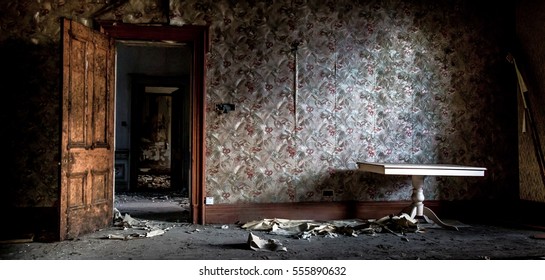 An Old Dark Mysterious Room. Scary Scene From A Haunted House. Decaying Walls And Floor Sat Rotting For Years.