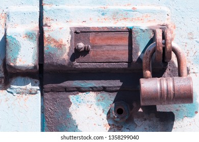 Old deadbolt with padlock.