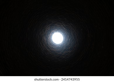 The old deep abandoned well. Inside view. The light at the end of the tunnel concept - Powered by Shutterstock