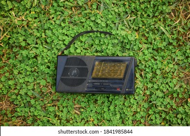 Old Delhi, Delhi / India - October 25, 2020: Vintage Kchibo Radio Lying On Grass.