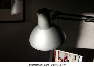 An Old Desk Lamp Is Hit By Evening Light.