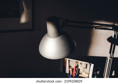 An Old Desk Lamp Is Hit By Evening Light.