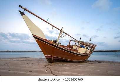 Old Dhow On A Beach In Ras Al Khaimah, United Arab Emirates