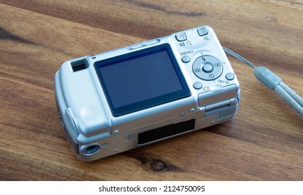 Old Digital Camera Isolated, Obsolete And Not In Use Anymore, Dusty And Dirty