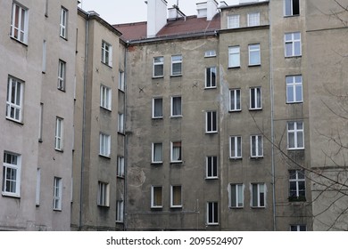 Old dilapidated tenement houses in Wrocław, ruins of concrete and brick.