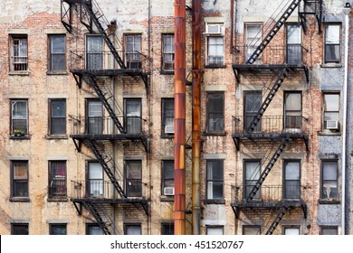Old dirty apartment buildings facing an alley in New York City