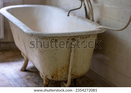 old dirty bathtub in a lost place