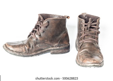 Old Dirty Boots On A White Background 