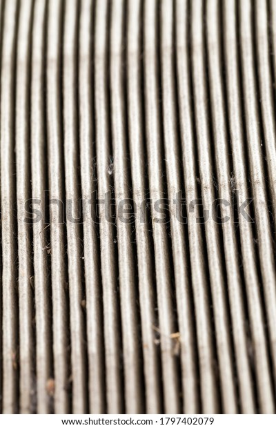 old dirty car air filter, closeup of disposable paper\
filter after use