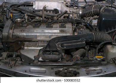 Old And Dirty Car Engine In The Garage.