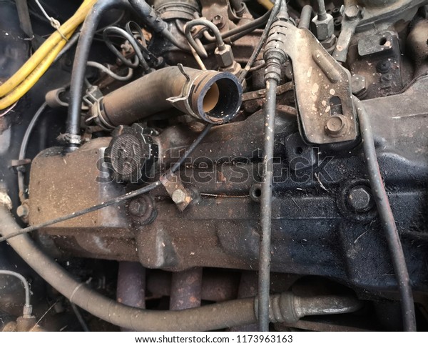 Old and Dirty Car Engine in the Garage,\
Automotive Machanical of Car\
Service.