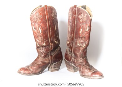 Old Dirty Cowboy Boots On A White Background