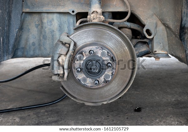 Old and dirty Disc brake replacement on car - Disk\
Brake System