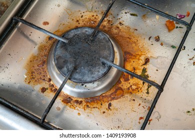 Old dirty gas stove. Fat on the surface. - Shutterstock ID 1409193908