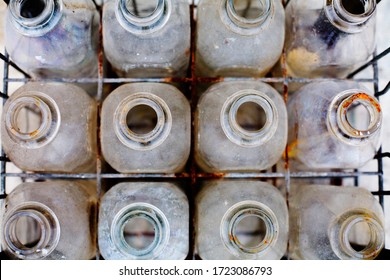 Old Dirty Milk Bottles In Crate