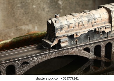 An Old And Dirty Plastic Train Toy Model On Bridge Model Scenery Represent The Train Toy For Hobby And Collection Concept Related Idea.