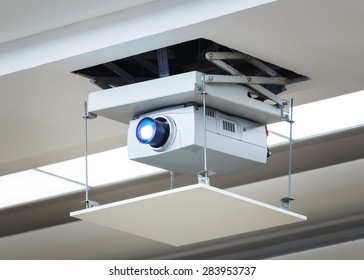 Old And Dirty Projector Hang On Ceiling In Meeting Room, Education Concept