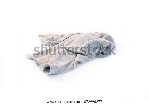 Old dirty rag isolated on white background. Cleaning rag