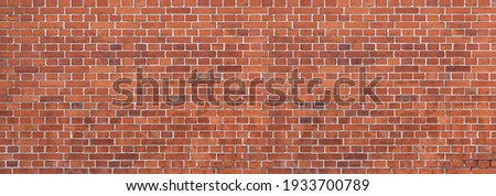 Old, dirty, red brick wall with partly slightly damaged brick stones - panorama