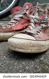 Old And Dirty Red Canvas Sneakers