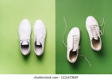 Old dirty sneakers vs new white sneakers on green background. Trendy footwear. Top view. Concept of experience, discipline and chaos, accuracy \ mess, stylish shoes. Back to school. - Shutterstock ID 1121673839