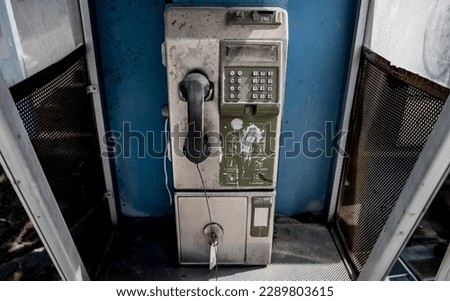 Old and dirty street phones at the city landfill