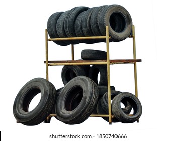 Old Dirty Tires On A Yellow Metal Rack Isolated On A White Background. Blank For Advertising And Design Of Tire Repair, Car Service.