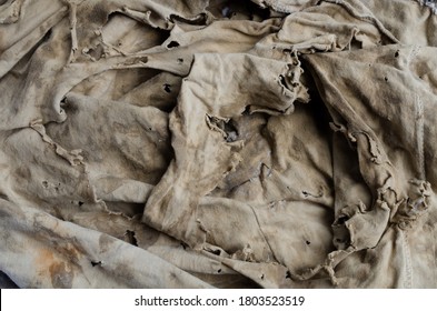 Old dirty torn rag isolated on white background. Cleaning rag.