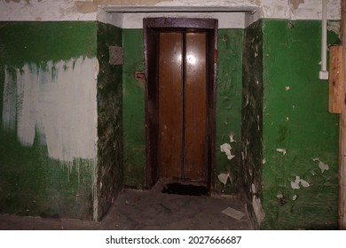 Old Dirty Walls And Entry Doors Of Elevator In An Abandoned House