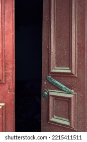 Old Dirty Wooden Red Door Is Ajar.