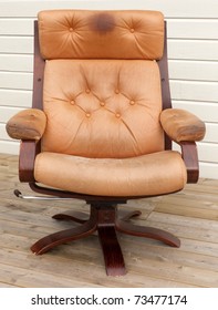 Old Dirty And Worn Leather Recliner Chair