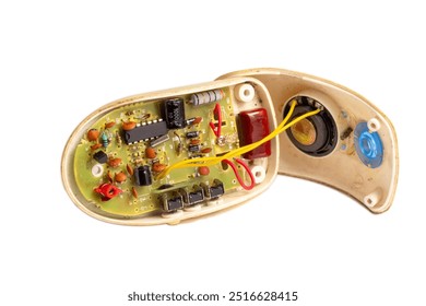 old disassembled computer mouse, internal components are visible