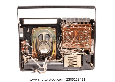 Old disassembled portable stereo cassette tape recorder from 80s