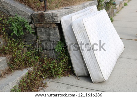 Similar – Image, Stock Photo Discarded mattress on the sidewalk in the light of a street lamp in front of an anonymous hotel façade