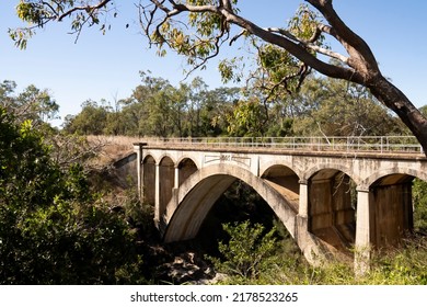 Old disused and abandoned concrete railway bridge with arches built in 1905 at Chowey on the old Biggenden to Gayndah line in Queensland, Australia. - Powered by Shutterstock