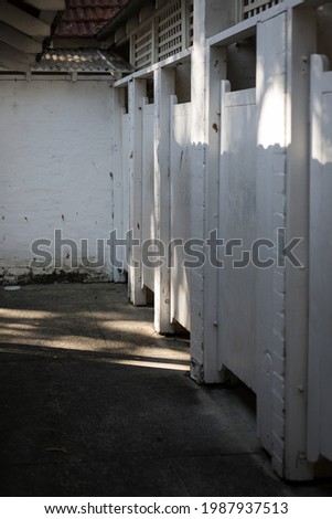 Old disused change rooms cast in shadows