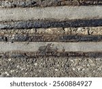 Old disused tram lines texture background. At North Wharf, Wynyard Quarter, Auckland, New Zealand.