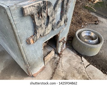 Old Dog Kennel And Bowl On New Zealand Farm