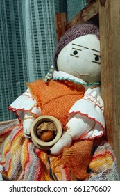 Old doll looking at camera. 
