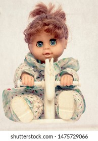 scary doll on rocking horse