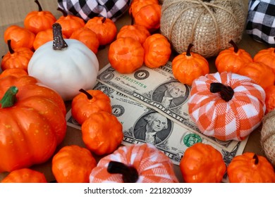 Old Dollar Money With Halloween Pumpkin Decorating On Table