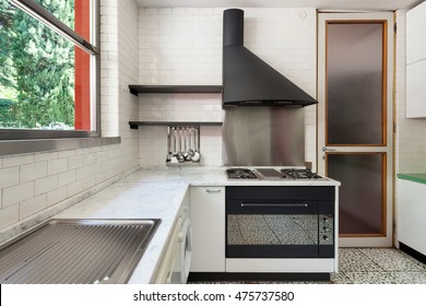 Old Domestic Kitchen Of An Apartment, Gas Stove With Hood