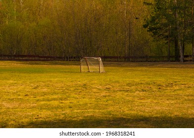 Old Domestic Small Football Goal With Grid. Football Goal With Fragmentary Grid In The Forest. No People. Football Field In The Village